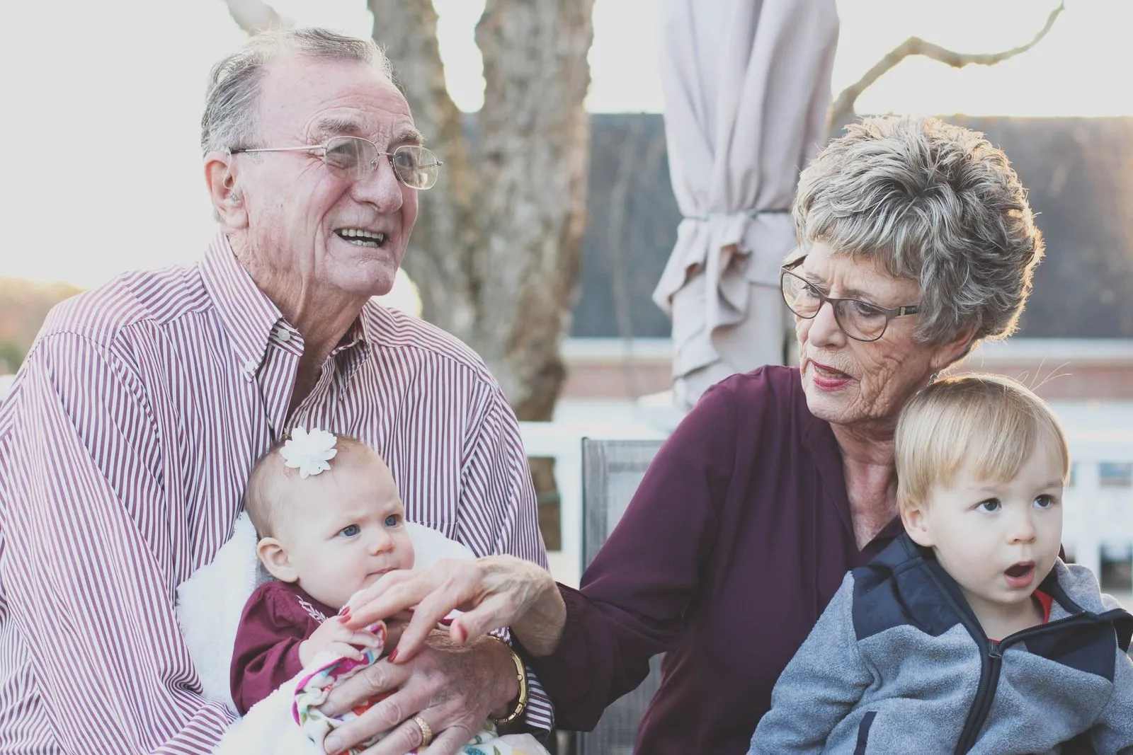 Smiling grandparents with their grandchildren